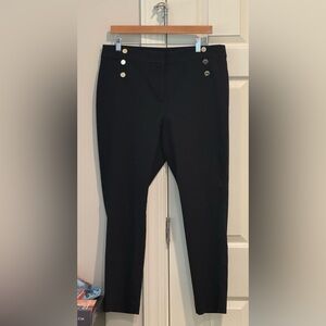 Womens black pants with gold button detail. High waist and curvy skinny fit.